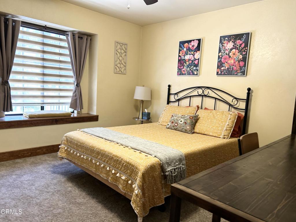 51793 Quail Ridge Road Oakhurst, CA 93644 - Photo 39 of 70 a bedroom with a bed and a window