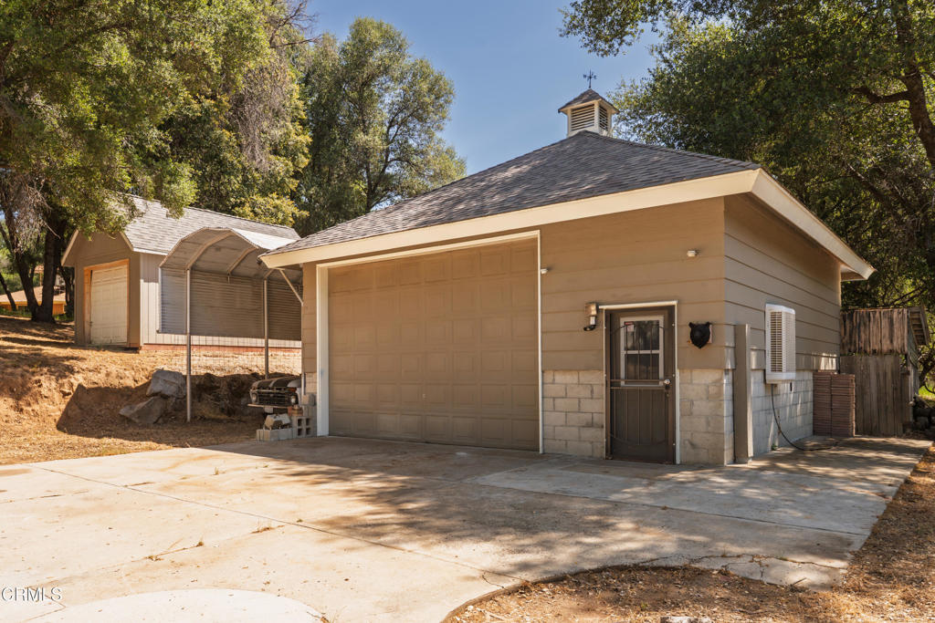51793 Quail Ridge Road Oakhurst, CA 93644 - Photo 48 of 70 a front view of a house with a yard