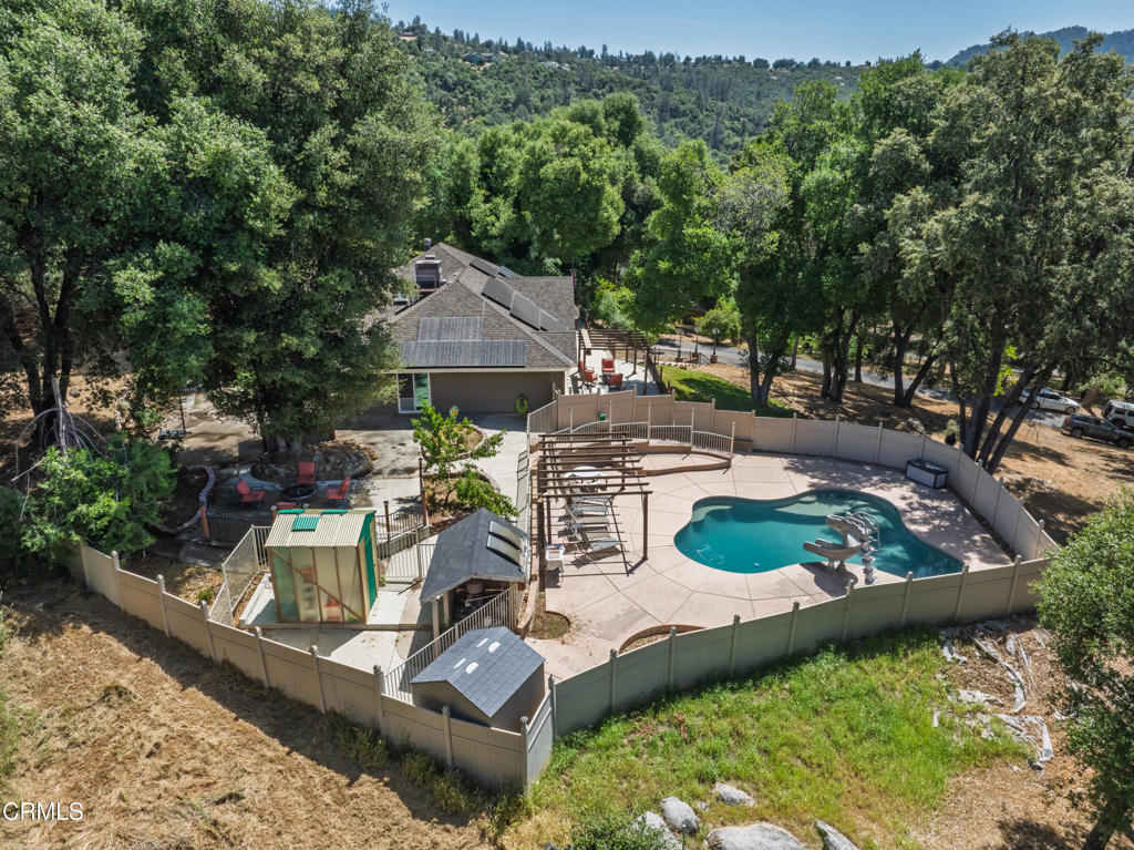 51793 Quail Ridge Road Oakhurst, CA 93644 - Photo 61 of 70 an aerial view of a house with swimming pool garden and patio