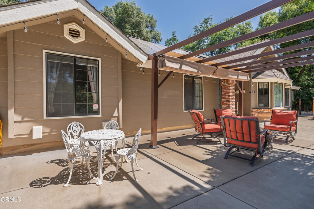 51793 Quail Ridge Road Oakhurst, CA 93644 - Photo 9 of 70 a patio with a table and chairs