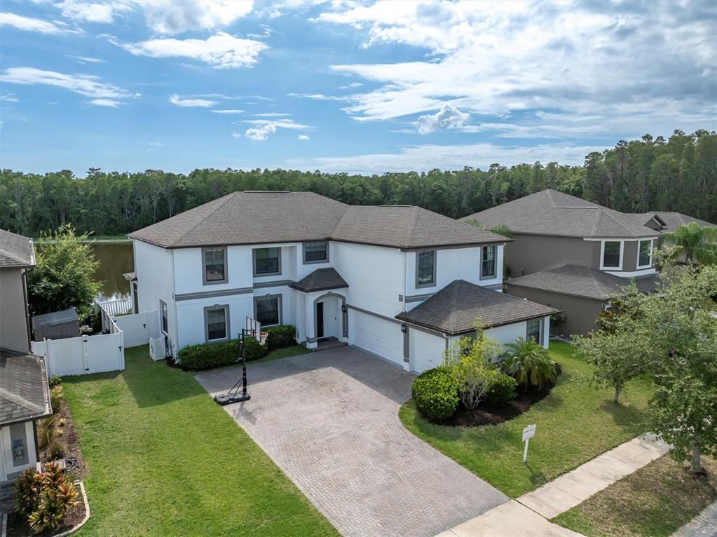 12135 Crestridge Loop Trinity, FL 34655 - Photo 1 of 1 an aerial view of a house with garden space and a patio