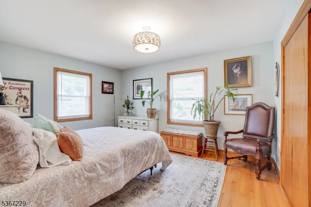 a bedroom with a bed furniture and a window