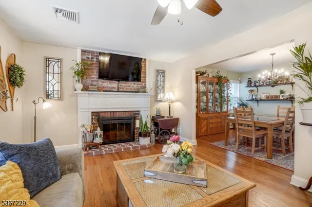 a living room with furniture fireplace and flat screen tv