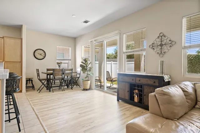 a large white kitchen with a large window