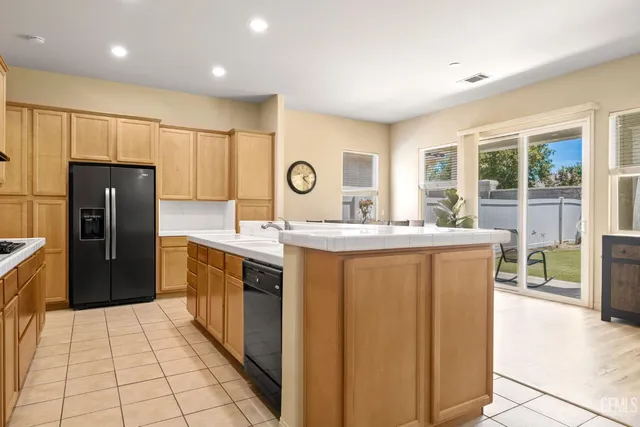 a kitchen with stainless steel appliances granite countertop a stove and a sink