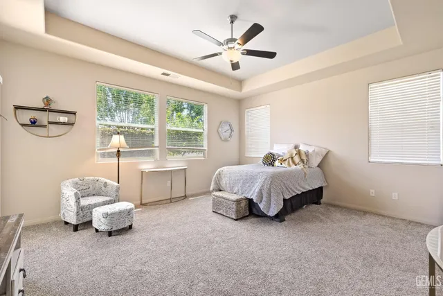 a spacious bathroom with a double vanity sink a mirror and a shower