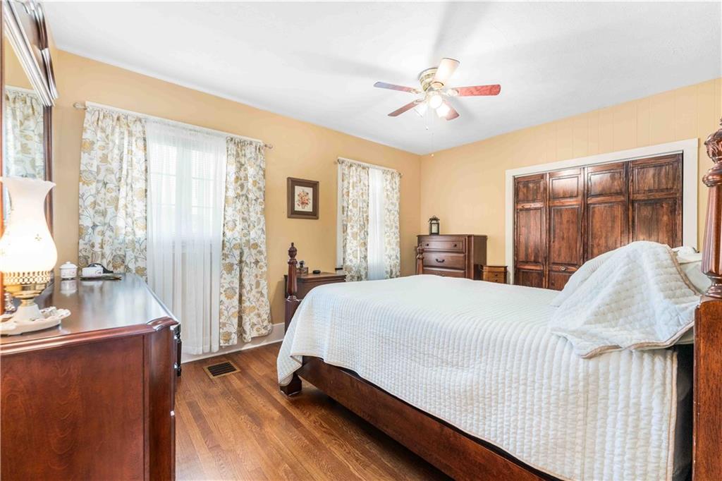 201 4th Street Beaver, PA 15009 - Photo 20 of 50 a bedroom with a large bed and a chandelier