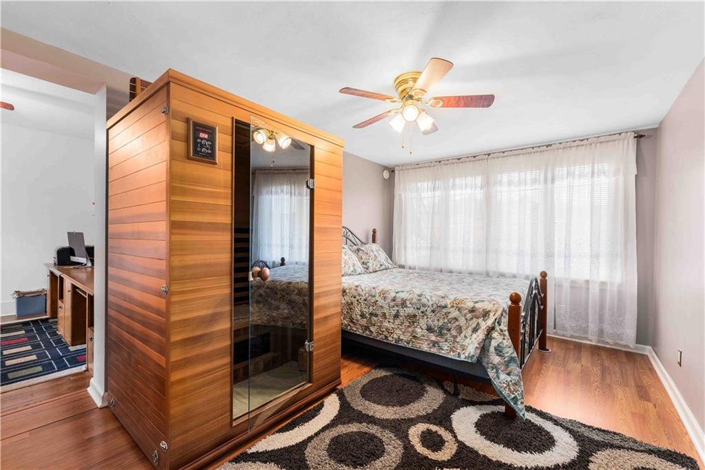 201 4th Street Beaver, PA 15009 - Photo 22 of 42 a bedroom with a bed and a chandelier