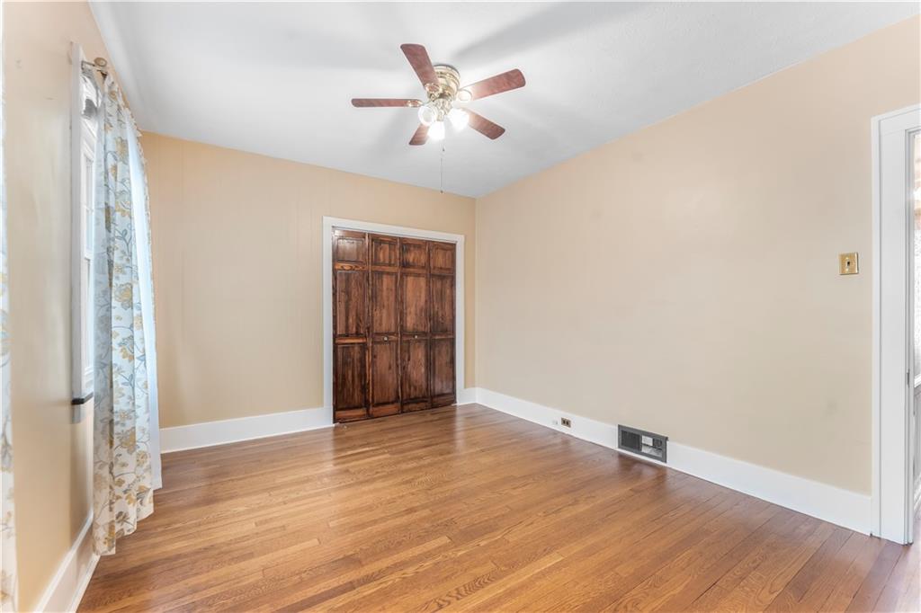 201 4th Street Beaver, PA 15009 - Photo 23 of 50 an empty room with wooden floor and windows