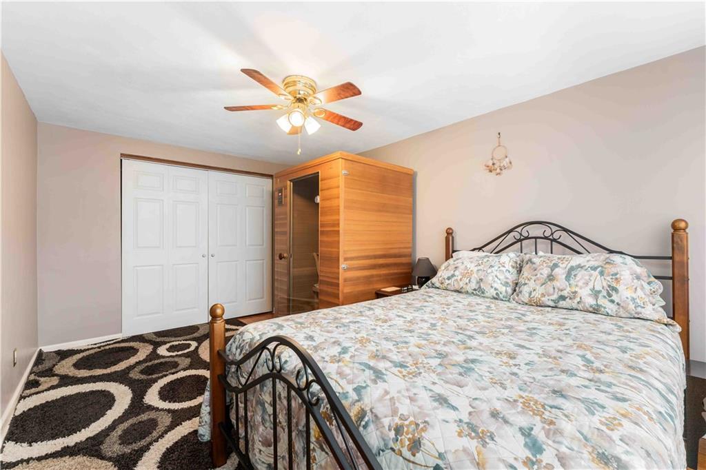 201 4th Street Beaver, PA 15009 - Photo 23 of 42 a bedroom with a bed and a chandelier