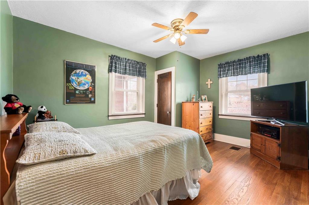 201 4th Street Beaver, PA 15009 - Photo 24 of 50 a bedroom with a bed and a flat screen tv