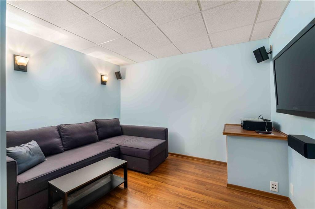 201 4th Street Beaver, PA 15009 - Photo 25 of 42 a living room with furniture and a flat screen tv