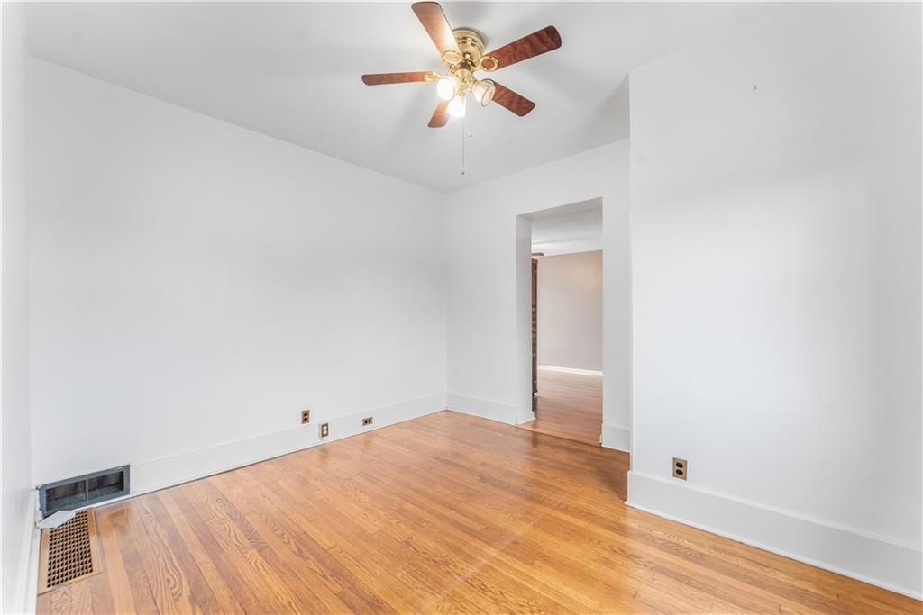 201 4th Street Beaver, PA 15009 - Photo 28 of 50 a view of a big room with wooden floor and a chandelier fan