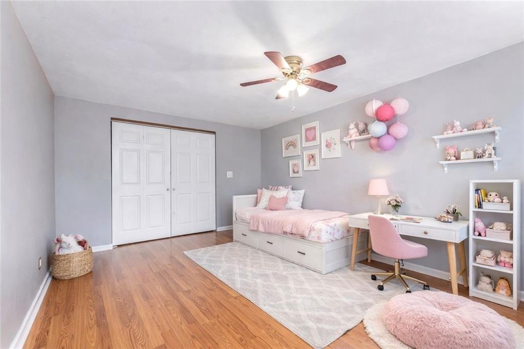 201 4th Street Beaver, PA 15009 - Photo 31 of 50 a bedroom with a bed and wooden floor