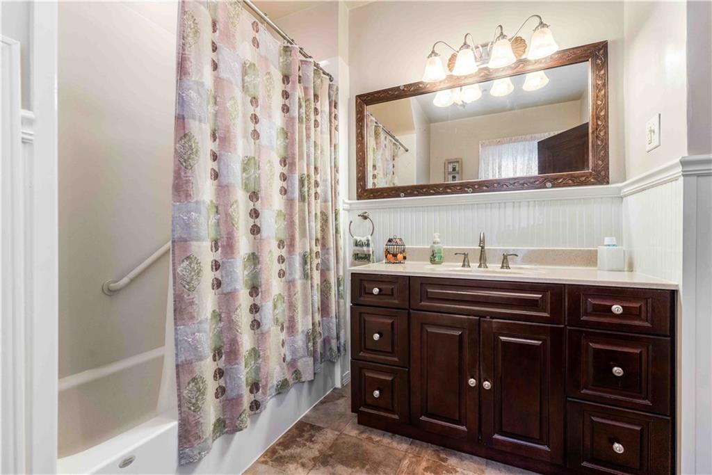 201 4th Street Beaver, PA 15009 - Photo 34 of 50 a bathroom with a sink vanity and a mirror
