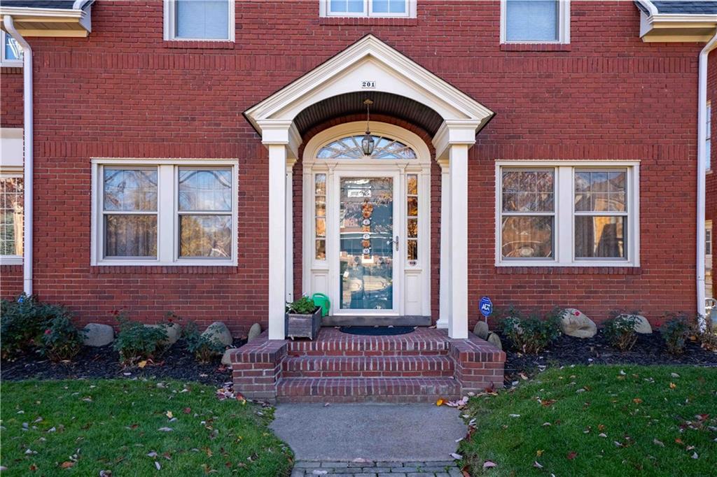 201 4th Street Beaver, PA 15009 - Photo 39 of 42 a view of a brick house with a small yard plants and large tree