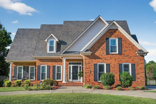 front view of a house with a yard