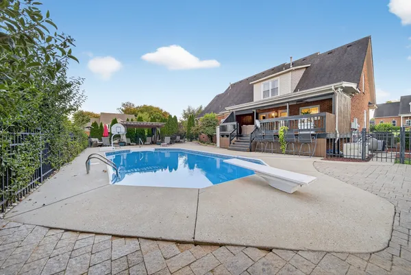 a view of a swimming pool with an outdoor seating