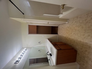14909 Nuttall Drive Austin, TX 78724 - Photo 7 of 13 a bathroom with a sink vanity granite tub shower and mirror