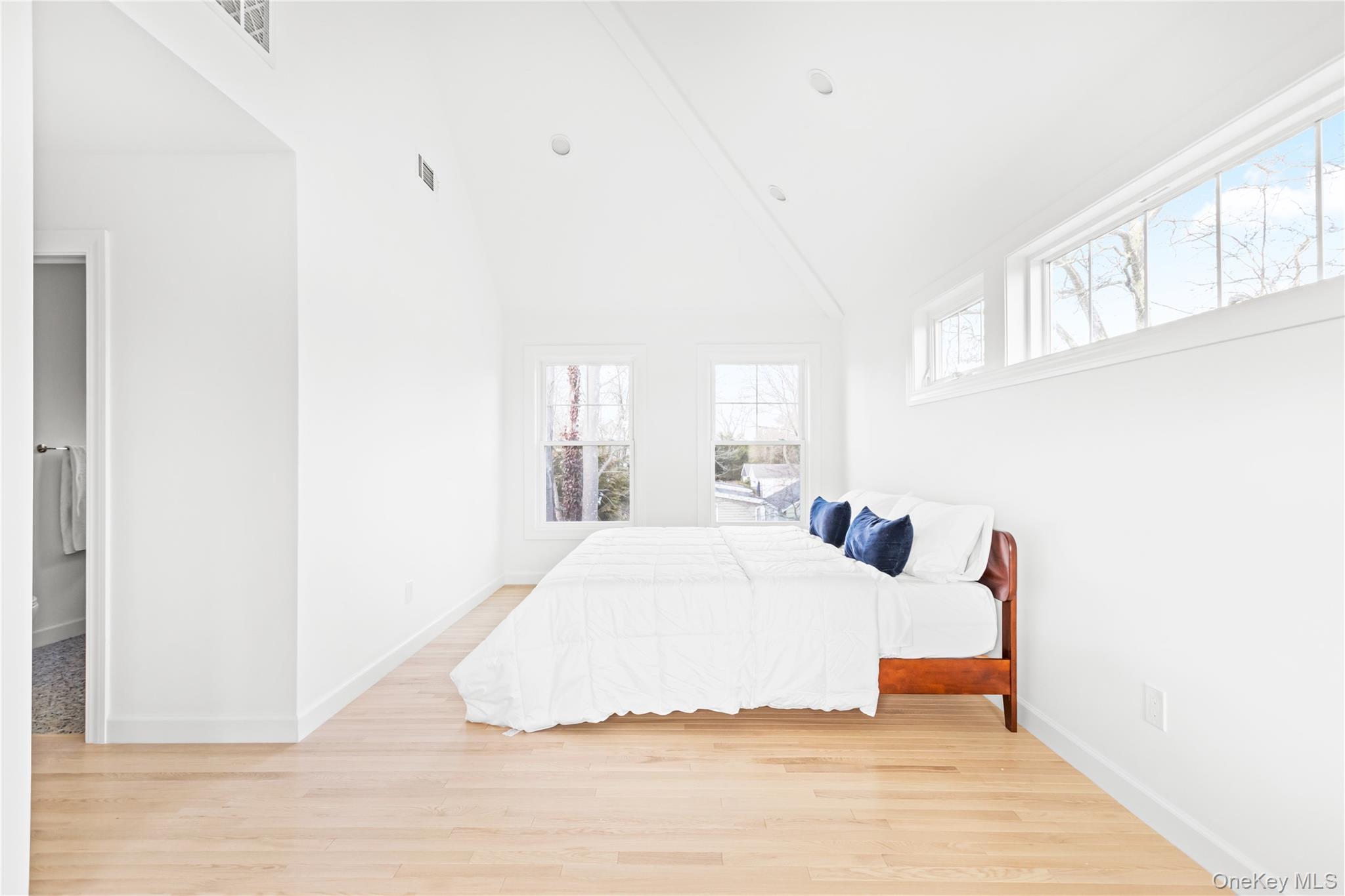 21 North Howells Point Road Bellport, NY 11713 - Photo 18 of 21 a bedroom with a bed and a window