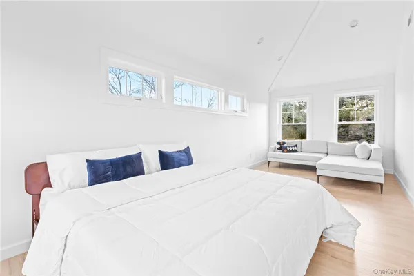 a bedroom with a bed and a couch