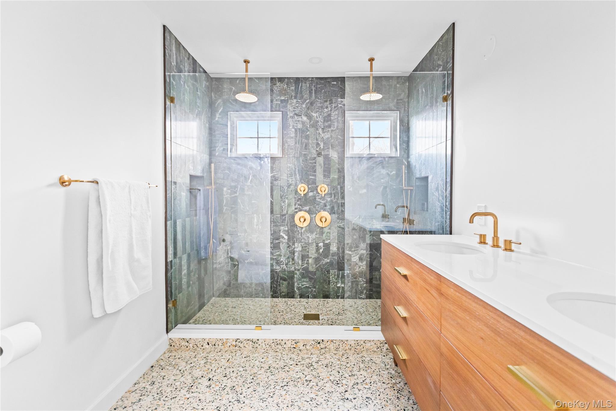 21 North Howells Point Road Bellport, NY 11713 - Photo 20 of 21 a bathroom with a granite countertop shower a sink and a mirror
