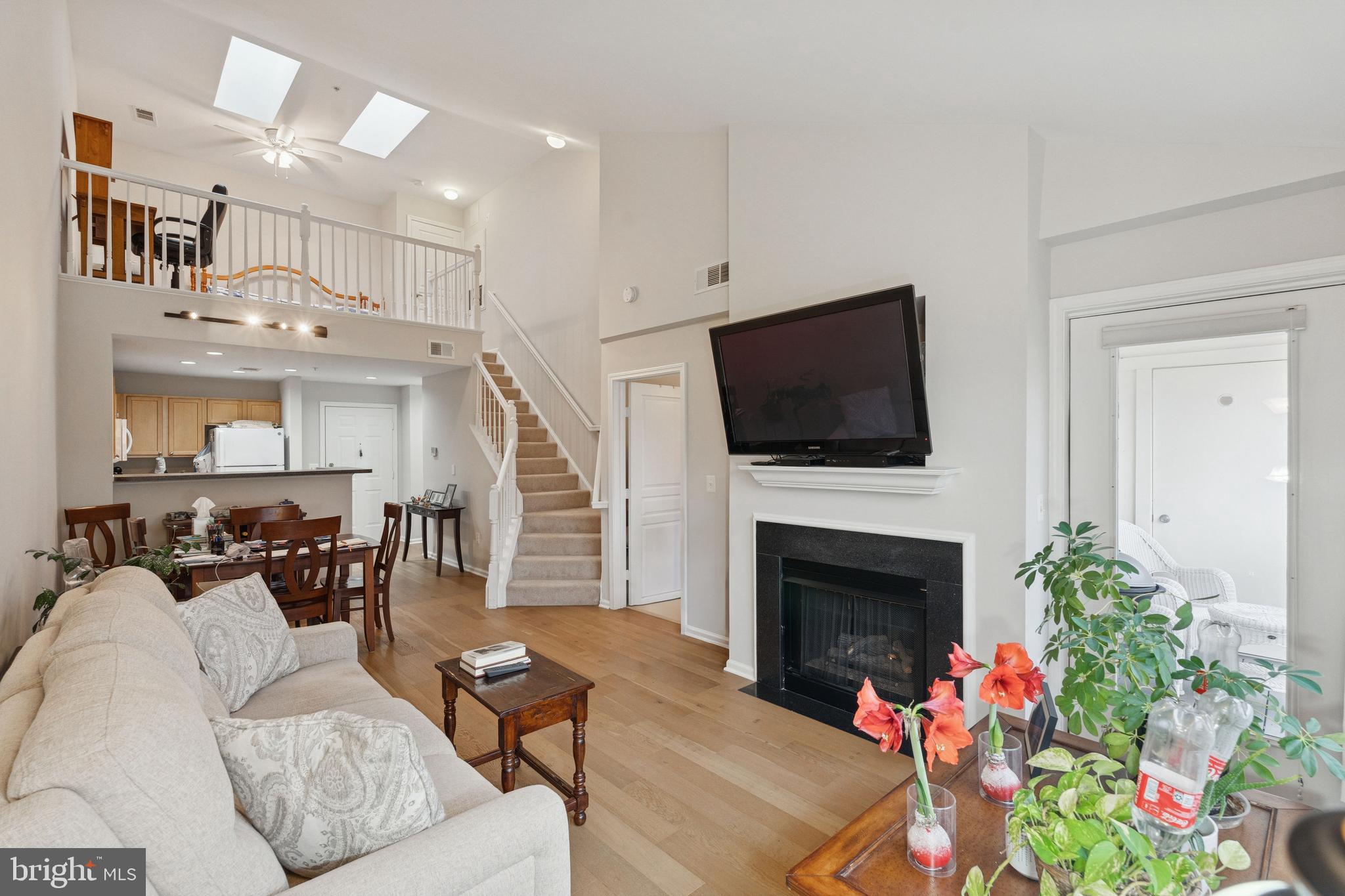 12000 Market Street, Unit 445 Reston, VA 20190 - Photo 50 of 51 a living room with furniture fireplace and flat screen tv