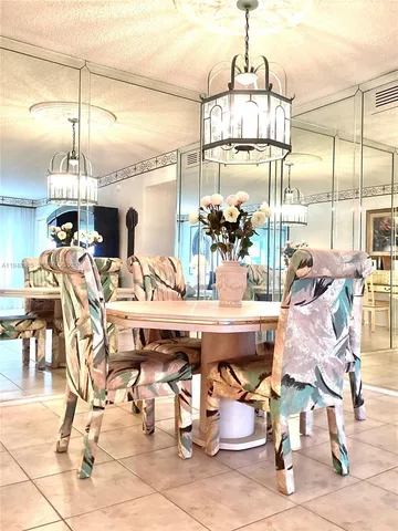 a bedroom with furniture and a large window