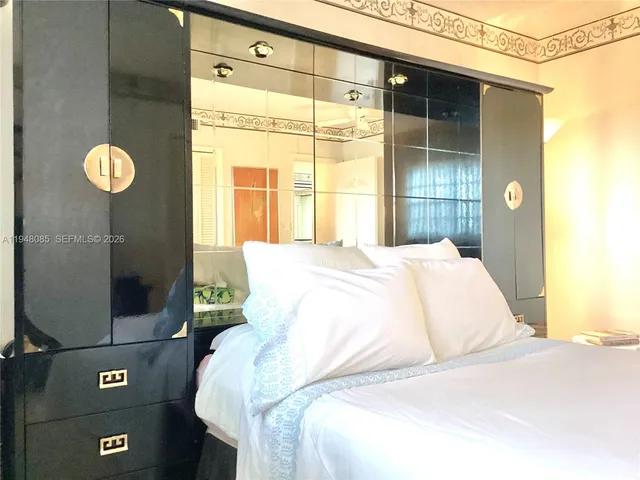 a view of a bathroom with a tub mirror and a shower