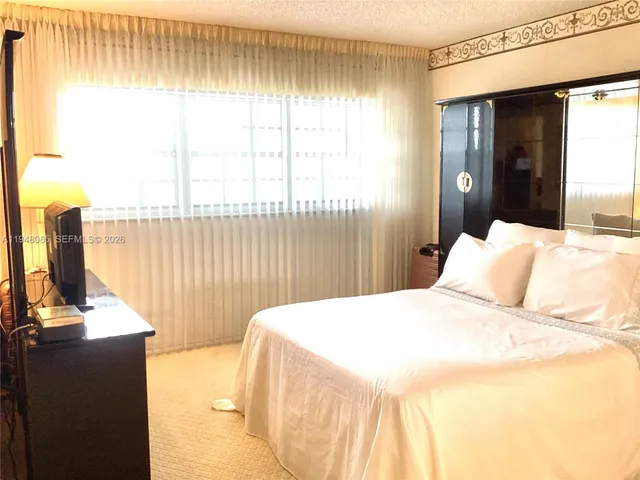 a bathroom with a mirror and a shower