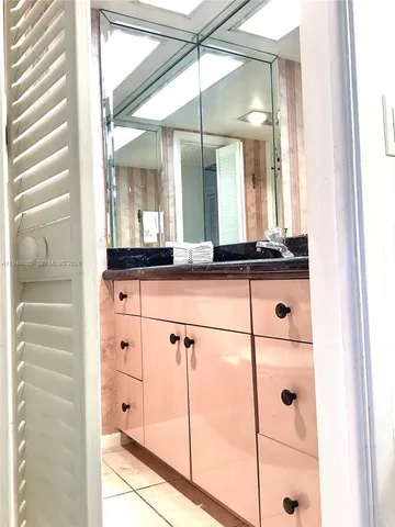 a living room with a flat screen tv and a window