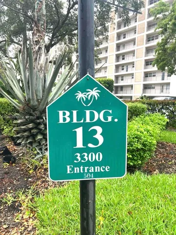 a kitchen with stainless steel appliances a refrigerator and cabinets