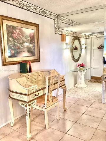 a kitchen with a stove a microwave and a refrigerator