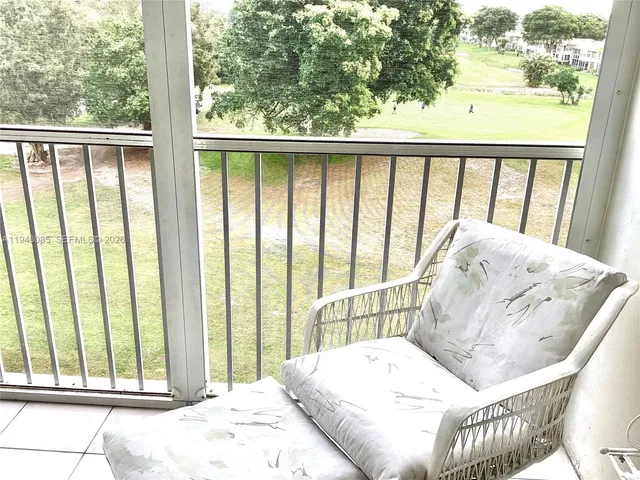 a view of a patio with a dining table and chairs