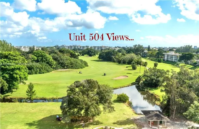 a view of swimming pool with a yard and sitting area