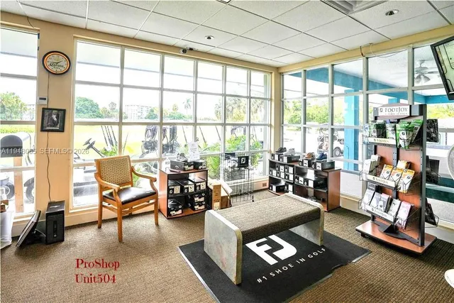 a view of a swimming pool with a table and chairs