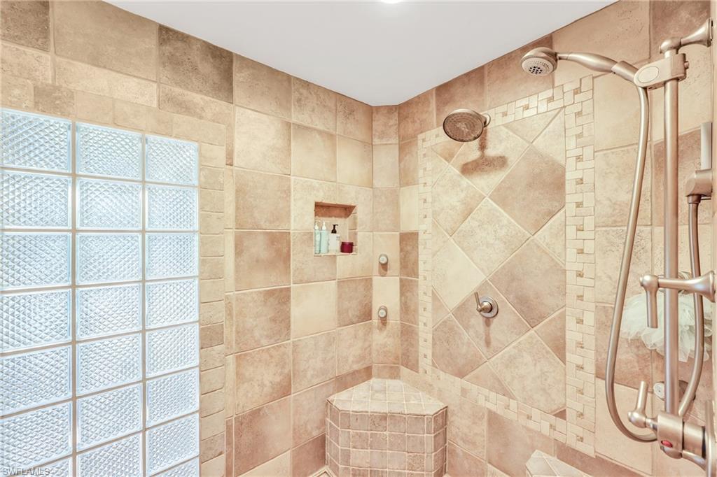 4870 Whispering Pine Way Naples, FL 34103 - Photo 19 of 43 a bathroom with a shower
