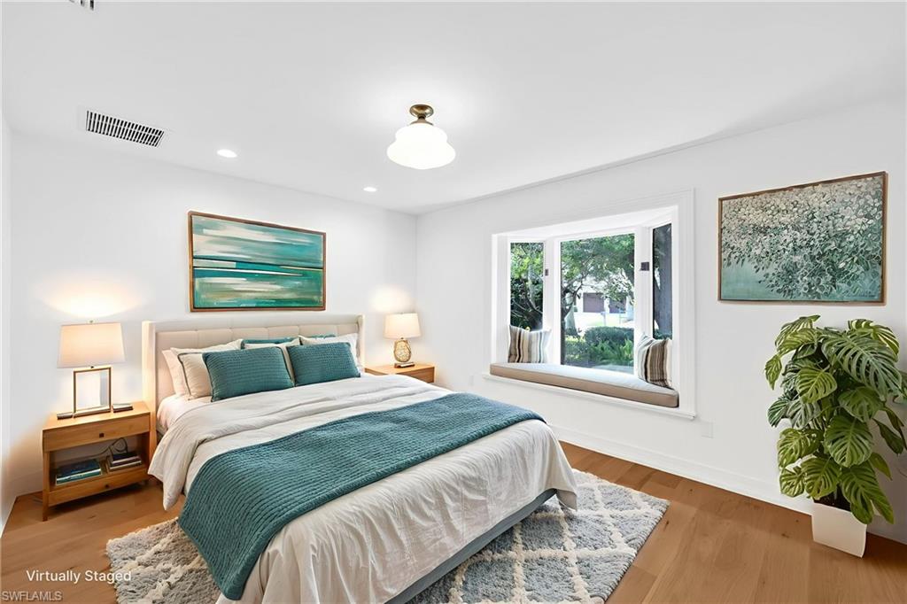4870 Whispering Pine Way Naples, FL 34103 - Photo 21 of 43 a bedroom with a bed and a window