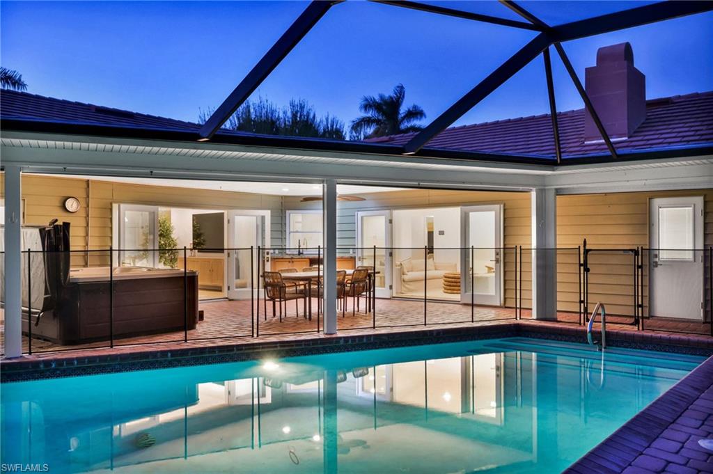4870 Whispering Pine Way Naples, FL 34103 - Photo 34 of 43 a view of swimming pool with outdoor seating