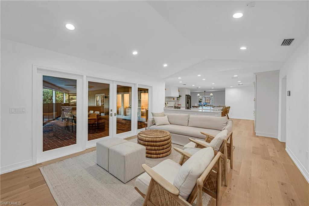4870 Whispering Pine Way Naples, FL 34103 - Photo 8 of 43 a view of a dining room with furniture and chandelier
