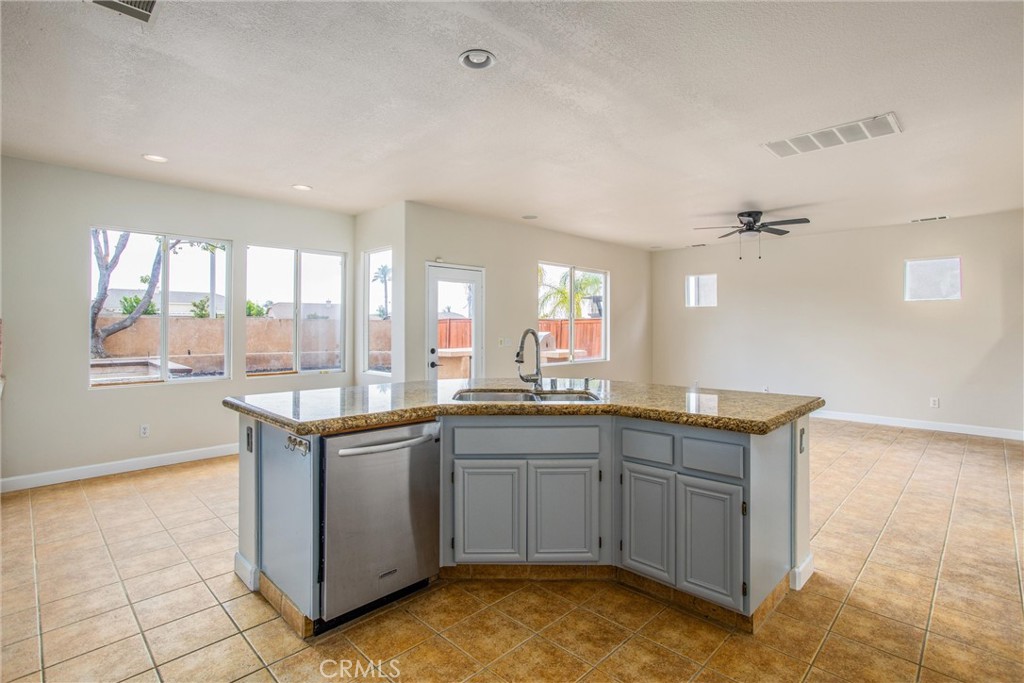 19429 Norwich Drive Riverside, CA 92508 - Photo 16 of 45 a kitchen with granite countertop a sink and cabinets
