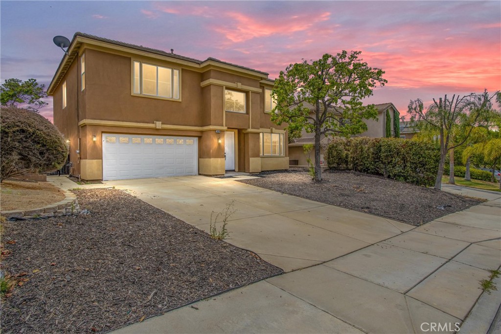 19429 Norwich Drive Riverside, CA 92508 - Photo 2 of 45 a front view of a house with a yard and garage