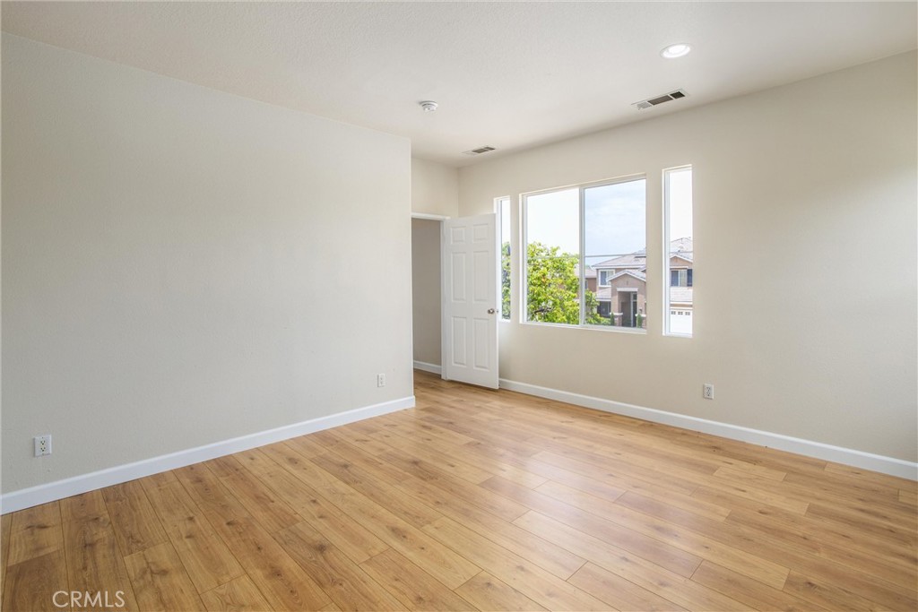 19429 Norwich Drive Riverside, CA 92508 - Photo 38 of 45 wooden floor in an empty room with a window