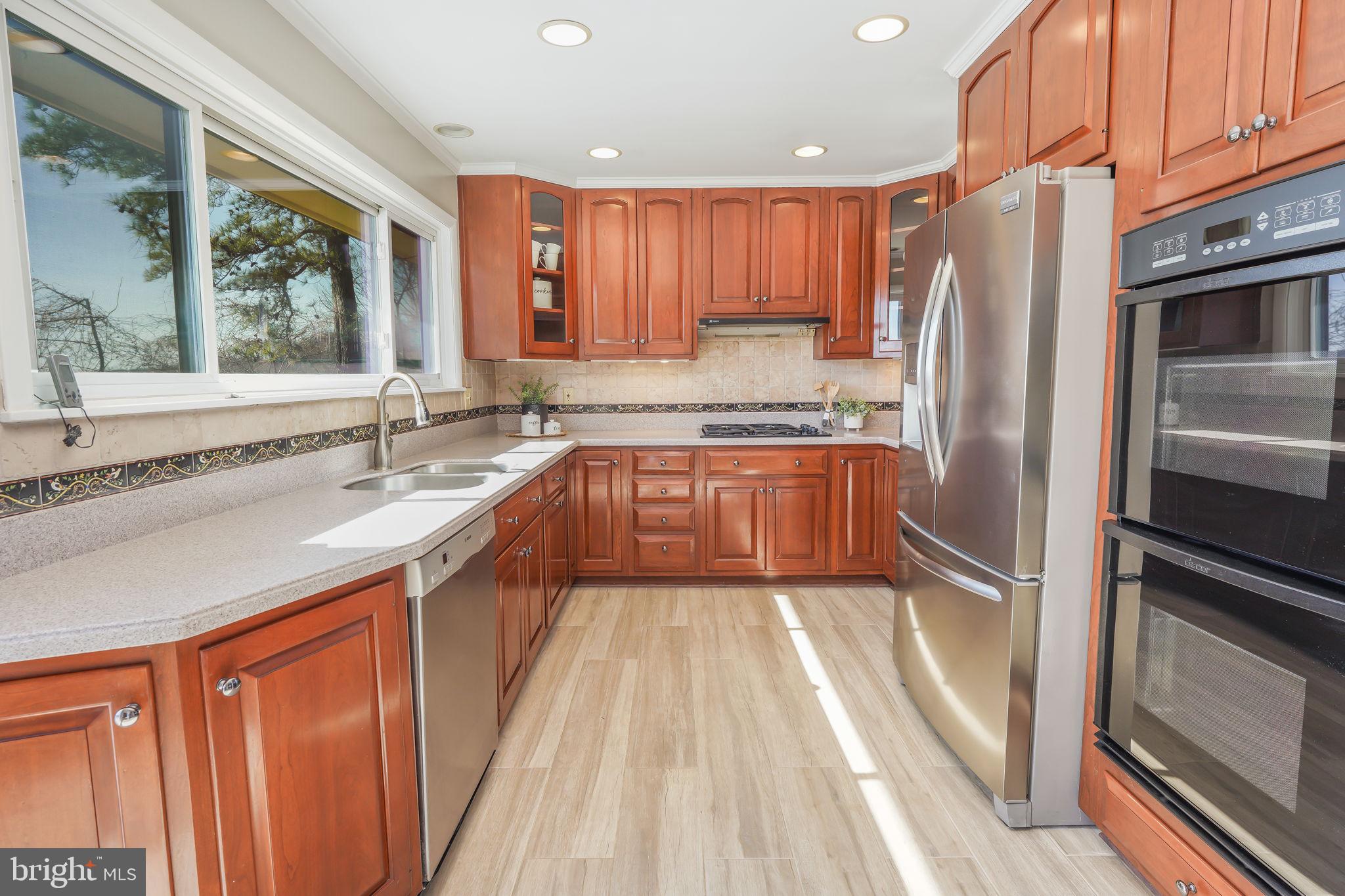 6239 Beverleys Mill Road Broad Run, VA 20137 - Photo 19 of 70 kitchen with ss and corian counters