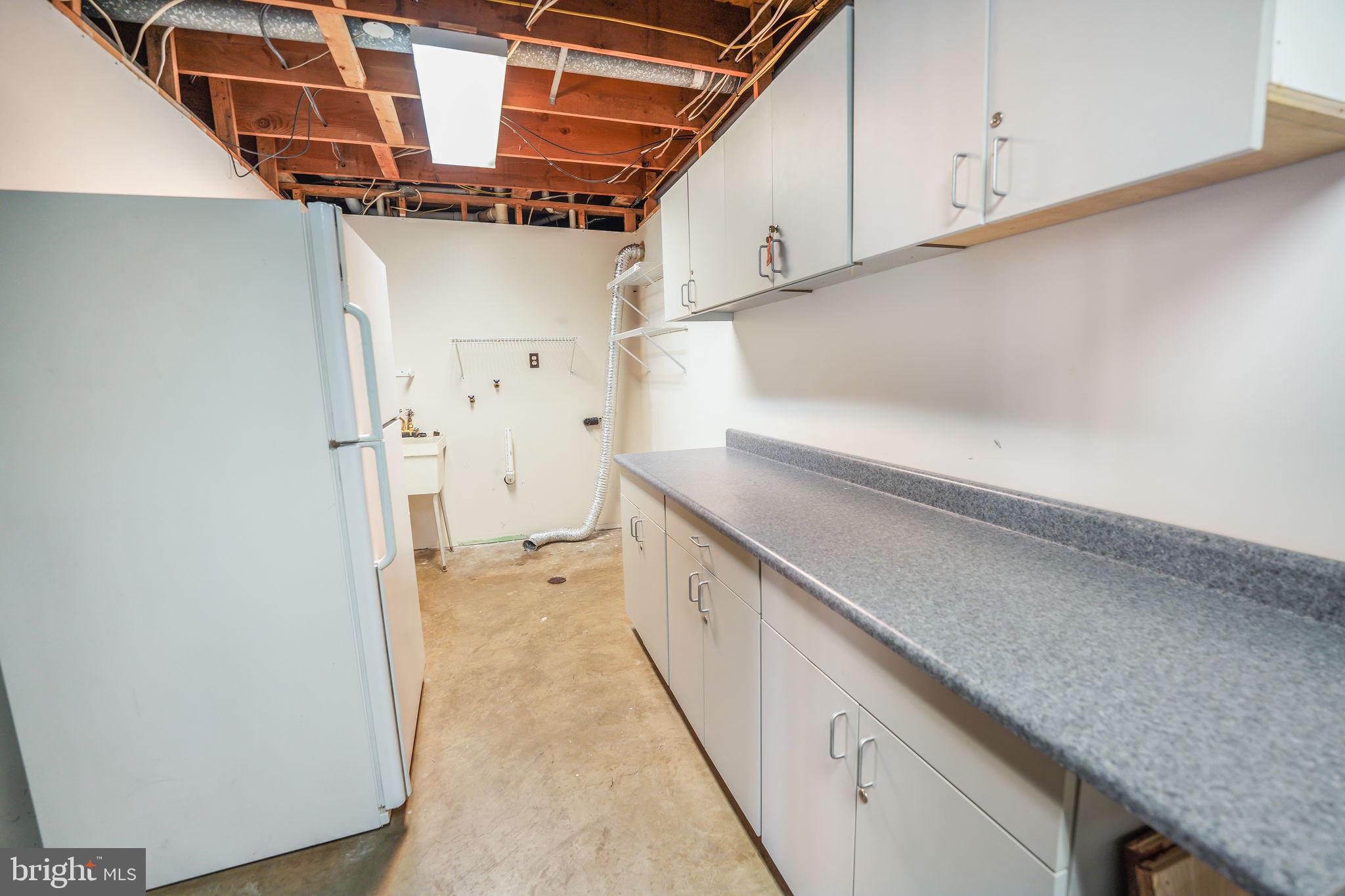 6239 Beverleys Mill Road Broad Run, VA 20137 - Photo 39 of 70 storage and laundry area in basement