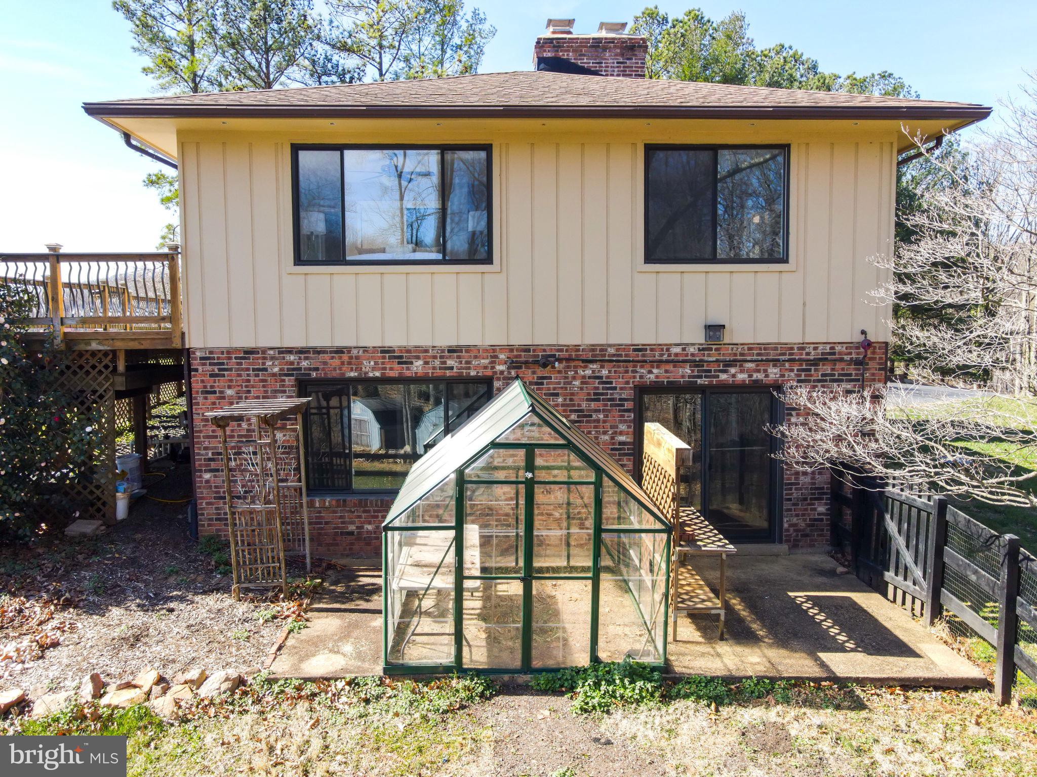 6239 Beverleys Mill Road Broad Run, VA 20137 - Photo 47 of 70 side of house with greenhouse