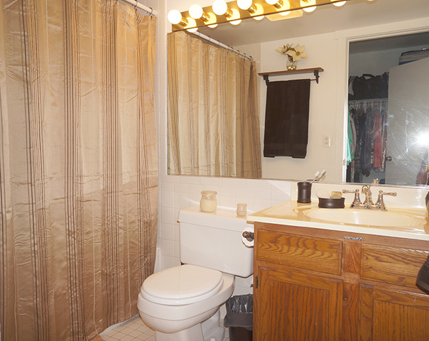 1 Renaissance Place, Unit 200 Palatine, IL 60067 - Photo 12 of 19 a bathroom with a toilet sink and mirror