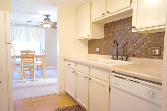 1 Renaissance Place, Unit 200 Palatine, IL 60067 - Photo 4 of 19 a kitchen with a sink and a refrigerator