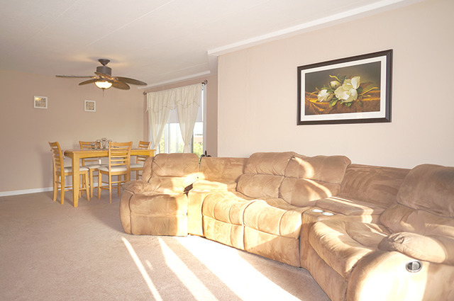 1 Renaissance Place, Unit 200 Palatine, IL 60067 - Photo 5 of 19 a living room with furniture and a chandelier
