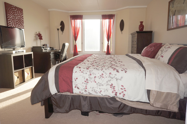 1 Renaissance Place, Unit 200 Palatine, IL 60067 - Photo 9 of 19 a bedroom with a bed and wooden floor